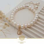 دستبند مروارید پرورشی و آویز طلا